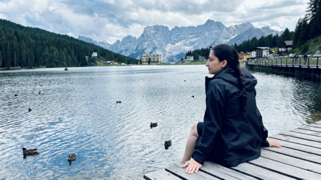 A serene morning at Misurina Lake, with mist rising over the water